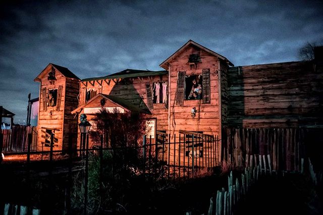 Display at 93 Walnut St — 93 Walnut St, Bloomfield, NJ 07003 (Haunted house covered in giant spiders, skeletons, ghosts;